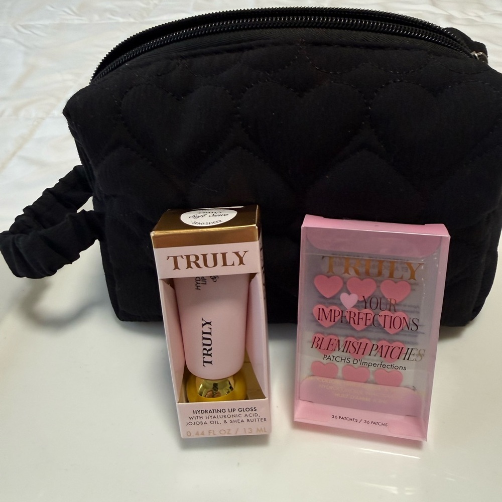 TRULY Pink Hydrating Lip Gloss, blemish patches, and a cosmetic bag.